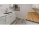 Kitchen boasts butcher block countertops and white cabinets at 1707 Boulderview Se Dr, Atlanta, GA 30316