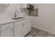 Modern kitchen with white shaker cabinets, quartz countertops, and stainless steel sink at 1707 Boulderview Se Dr, Atlanta, GA 30316