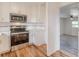 Updated kitchen with stainless steel appliances and hardwood floors at 1707 Boulderview Se Dr, Atlanta, GA 30316