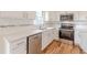 Modern kitchen, featuring white cabinets and quartz countertops at 1707 Boulderview Se Dr, Atlanta, GA 30316