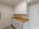 White cabinets and butcher block countertops at 1707 Boulderview Se Dr, Atlanta, GA 30316