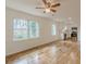 Open concept living and kitchen area with hardwood floors and ceiling fan at 1707 Boulderview Se Dr, Atlanta, GA 30316