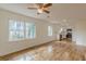 Open concept living and kitchen area with hardwood floors and ceiling fan at 1707 Boulderview Se Dr, Atlanta, GA 30316