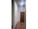 Hallway featuring wood-look floors and access to storage at 250 Pharr Ne Rd # 1704, Atlanta, GA 30305