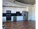 Modern kitchen with stainless steel appliances and wood flooring at 250 Pharr Ne Rd # 1704, Atlanta, GA 30305
