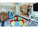 Fun playroom with a colorful indoor trampoline and ample toy storage at 5190 Crestview Dr Se, Covington, GA 30014