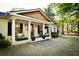 Charming covered porch with rocking chairs and planters at 5190 Crestview Dr Se, Covington, GA 30014