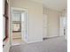 Spacious bedroom with carpet flooring and access to a private balcony at 898 Oak St # 2003, Atlanta, GA 30310