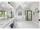 Spa-like bathroom with double vanity, soaking tub, and frameless shower at 115 Parkside Close, Alpharetta, GA 30022