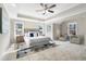 Bright bedroom with ceiling fan, ample natural light, and sitting area at 115 Parkside Close, Alpharetta, GA 30022