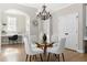 Casual dining area with glass top table and built-in workspace at 115 Parkside Close, Alpharetta, GA 30022