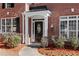 Elegant front entrance with a black door and white columns at 115 Parkside Close, Alpharetta, GA 30022
