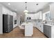 Bright kitchen with white cabinets, stainless steel appliances, and hardwood floors at 115 Parkside Close, Alpharetta, GA 30022