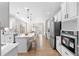 Spacious kitchen featuring an island, hardwood floors, and stainless steel appliances at 115 Parkside Close, Alpharetta, GA 30022