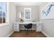 Bright home office features a built-in desk and hardwood floors at 115 Parkside Close, Alpharetta, GA 30022