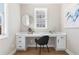 Home office with built-in desk, hardwood floors, and large window at 115 Parkside Close, Alpharetta, GA 30022