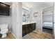 Double vanity bathroom with dark brown cabinets at 117 Gloster Mill Way, Lawrenceville, GA 30044