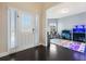 Bright entryway with hardwood floors and view into a play area at 117 Gloster Mill Way, Lawrenceville, GA 30044