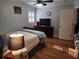 Bedroom with hardwood floors, a ceiling fan, and a dresser with a TV at 118 Lucia Se Dr, Smyrna, GA 30082