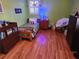 bedroom featuring hardwood floors, green walls, and playful decor at 118 Lucia Se Dr, Smyrna, GA 30082