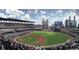 Panoramic view of Truist Park, filled with fans, and the sprawling cityscape in the background at 118 Lucia Se Dr, Smyrna, GA 30082