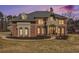 Two story brick home with landscaping at 715 Jewel Sw Ct, Atlanta, GA 30331