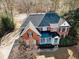 Two-story brick home with a large yard and driveway at 9919 Bridgewater Pointe, Villa Rica, GA 30180