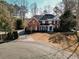 Two-story brick home with a large yard and cul-de-sac at 9919 Bridgewater Pointe, Villa Rica, GA 30180