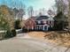 Two-story brick home with a large yard and cul-de-sac at 9919 Bridgewater Pointe, Villa Rica, GA 30180