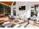 Covered back deck with comfortable seating and a large TV at 9919 Bridgewater Pointe, Villa Rica, GA 30180