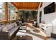 Relaxing back deck with seating area, covered patio, and surrounding bamboo at 9919 Bridgewater Pointe, Villa Rica, GA 30180