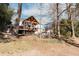 Landscaped backyard with deck and wooded area at 9919 Bridgewater Pointe, Villa Rica, GA 30180