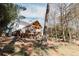 House backyard view, deck and lush green landscape at 9919 Bridgewater Pointe, Villa Rica, GA 30180