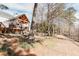House backyard view, deck and lush green landscape at 9919 Bridgewater Pointe, Villa Rica, GA 30180