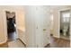 Main bathroom with linen closet, bathtub, toilet and shower at 9919 Bridgewater Pointe, Villa Rica, GA 30180