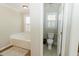 Bathroom includes a jetted bathtub and separate toilet area at 9919 Bridgewater Pointe, Villa Rica, GA 30180
