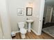 Small bathroom with pedestal sink and toilet at 9919 Bridgewater Pointe, Villa Rica, GA 30180