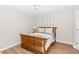 Basement bedroom with wood frame bed and neutral decor at 9919 Bridgewater Pointe, Villa Rica, GA 30180