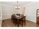 Bright dining room features hardwood floors and large windows at 9919 Bridgewater Pointe, Villa Rica, GA 30180