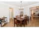 Spacious dining room with hardwood floors and chandelier at 9919 Bridgewater Pointe, Villa Rica, GA 30180