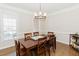 Formal dining room with hardwood floors and chandelier at 9919 Bridgewater Pointe, Villa Rica, GA 30180