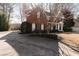 Two story brick home with a large front porch and driveway at 9919 Bridgewater Pointe, Villa Rica, GA 30180