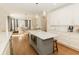 Eat-in kitchen with white cabinets, island, and hardwood floors at 9919 Bridgewater Pointe, Villa Rica, GA 30180