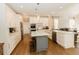 Spacious kitchen with white cabinets, large island, and stainless steel appliances at 9919 Bridgewater Pointe, Villa Rica, GA 30180