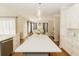 Open concept kitchen with white cabinets and a large island at 9919 Bridgewater Pointe, Villa Rica, GA 30180