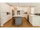 Spacious kitchen with white cabinets, large island, and stainless steel appliances at 9919 Bridgewater Pointe, Villa Rica, GA 30180