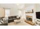 Cozy living room featuring a stone fireplace and large sectional sofa at 9919 Bridgewater Pointe, Villa Rica, GA 30180
