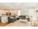 Open concept living room with sectional sofa and access to kitchen at 9919 Bridgewater Pointe, Villa Rica, GA 30180