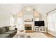 Living room with vaulted ceiling, stone fireplace, and hardwood floors at 9919 Bridgewater Pointe, Villa Rica, GA 30180