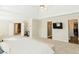 Main bedroom with high ceilings, carpeted floor, and ensuite bathroom at 9919 Bridgewater Pointe, Villa Rica, GA 30180